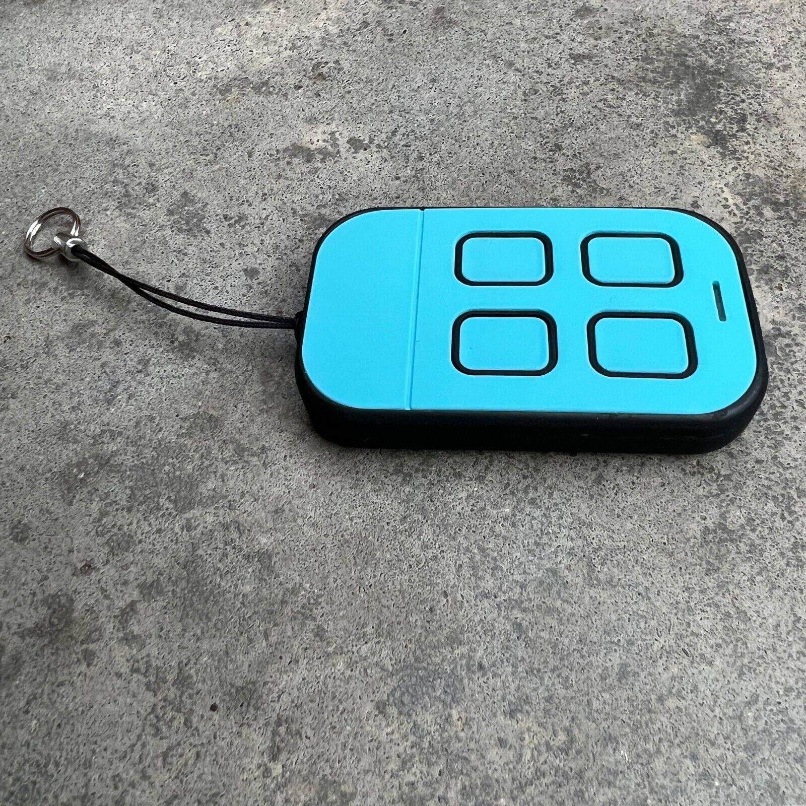 ATA PTX4 compatible remote control in blue with four buttons and a keychain attachment