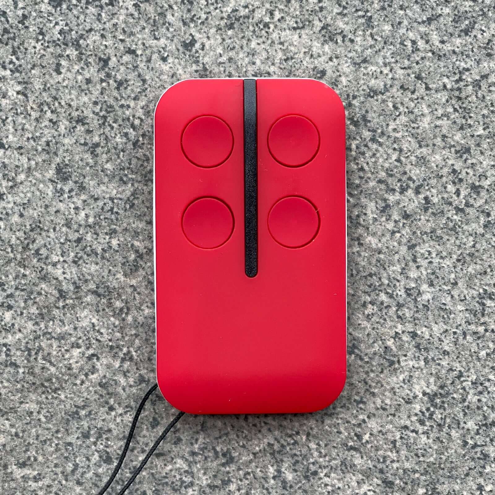 Red BFT Type B RCB TX2/TX4/0678 Mitto garage door gate compatible remote control with four buttons and key ring.