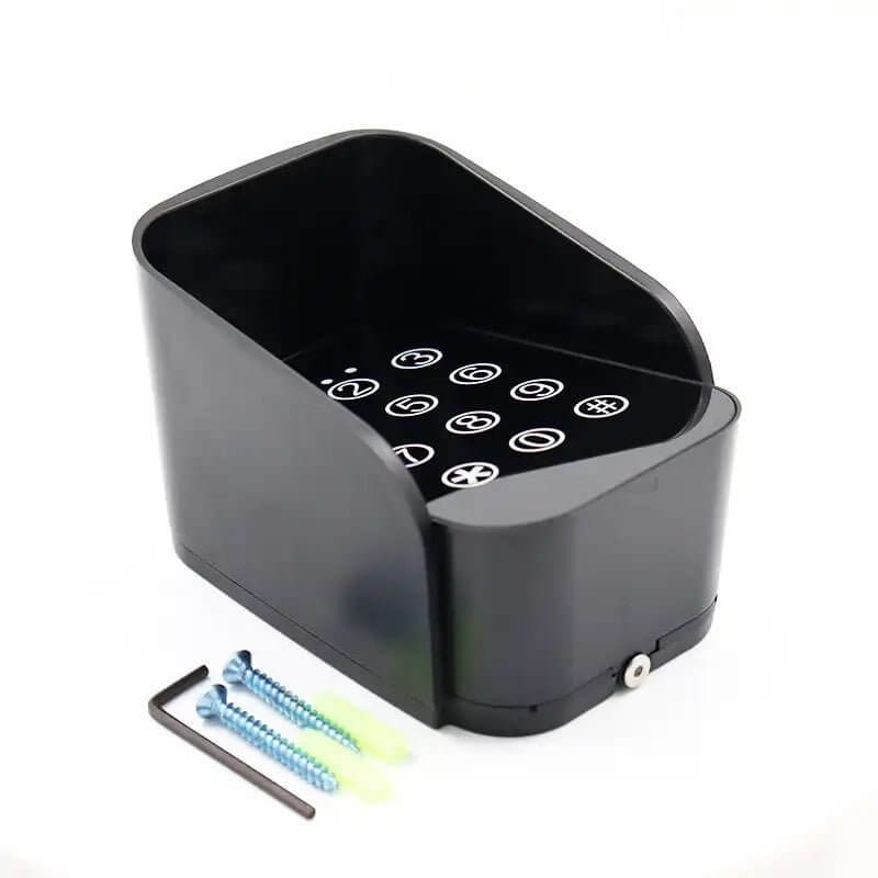 Black lock box with numeric keypad and mounting screws for secure storage
