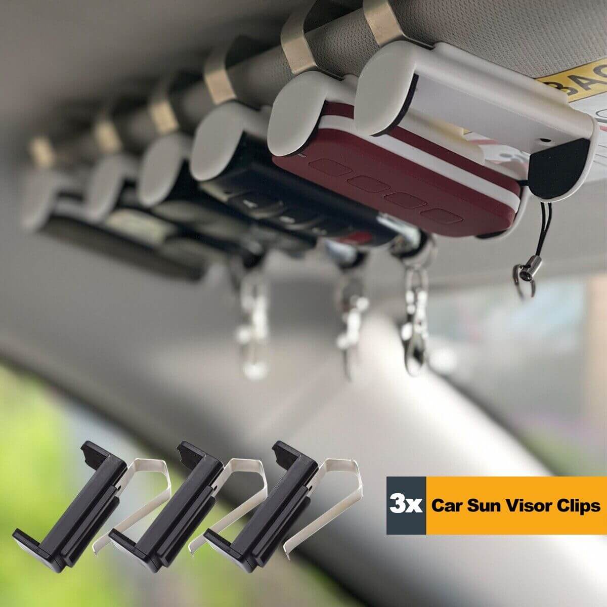 Car sun visor clips holding various items, 3x clips in black and silver, securely attached to a vehicle's sun visor for organization.