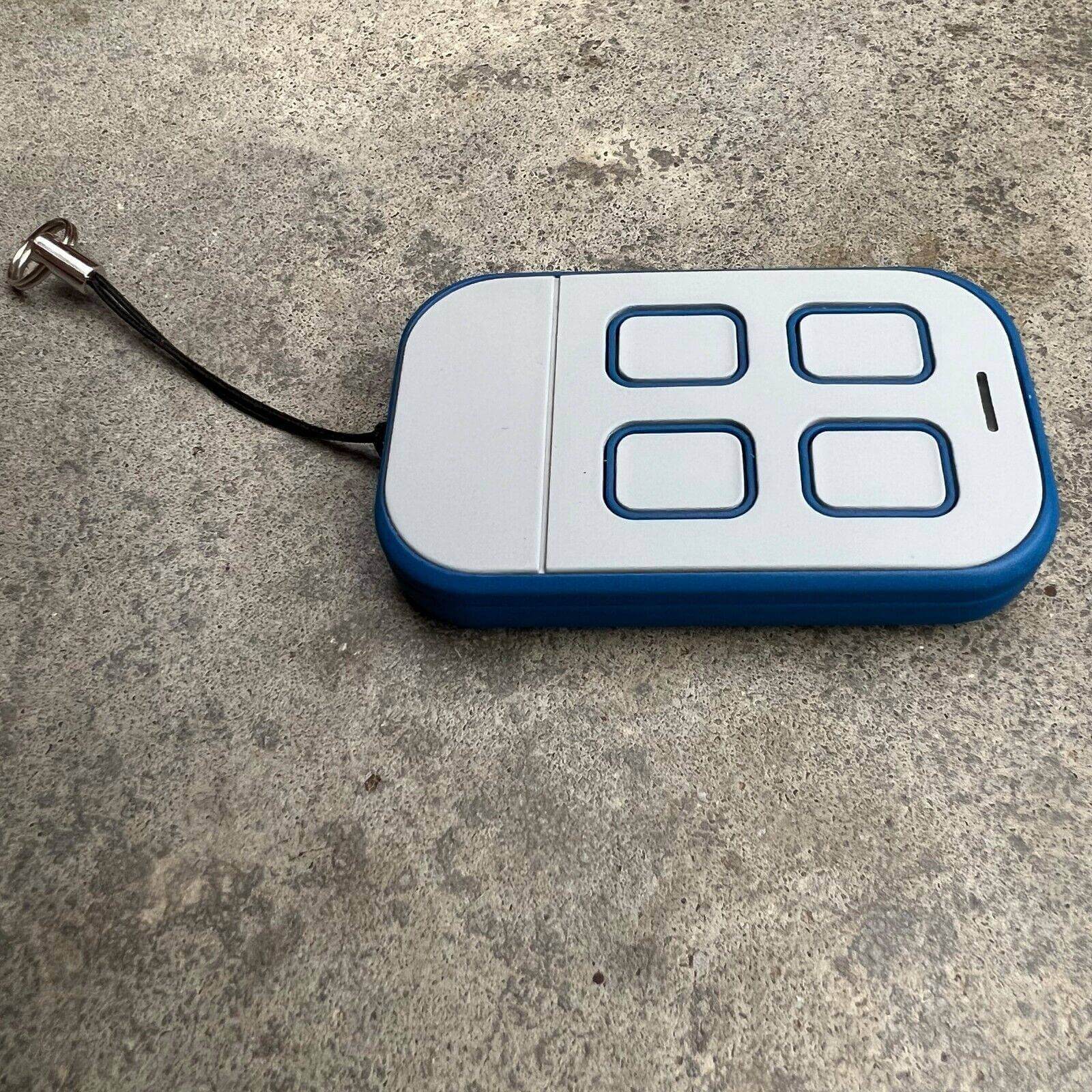 Ditec compatible remote control with keyring, featuring four buttons on a blue background for garage and gate access.