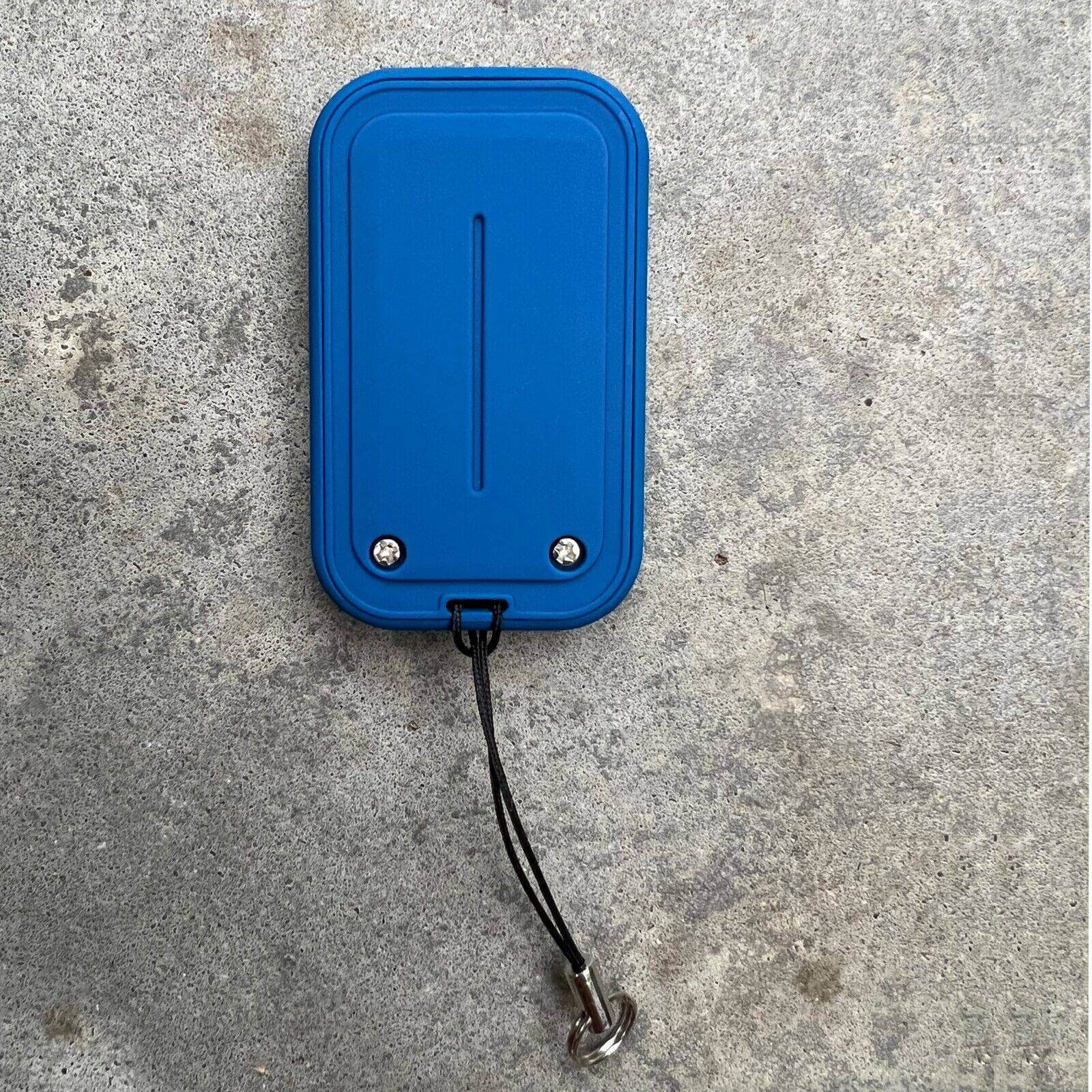 Ditec compatible remote control in blue color with keyring and attachment loop, ideal for garage and gate access.