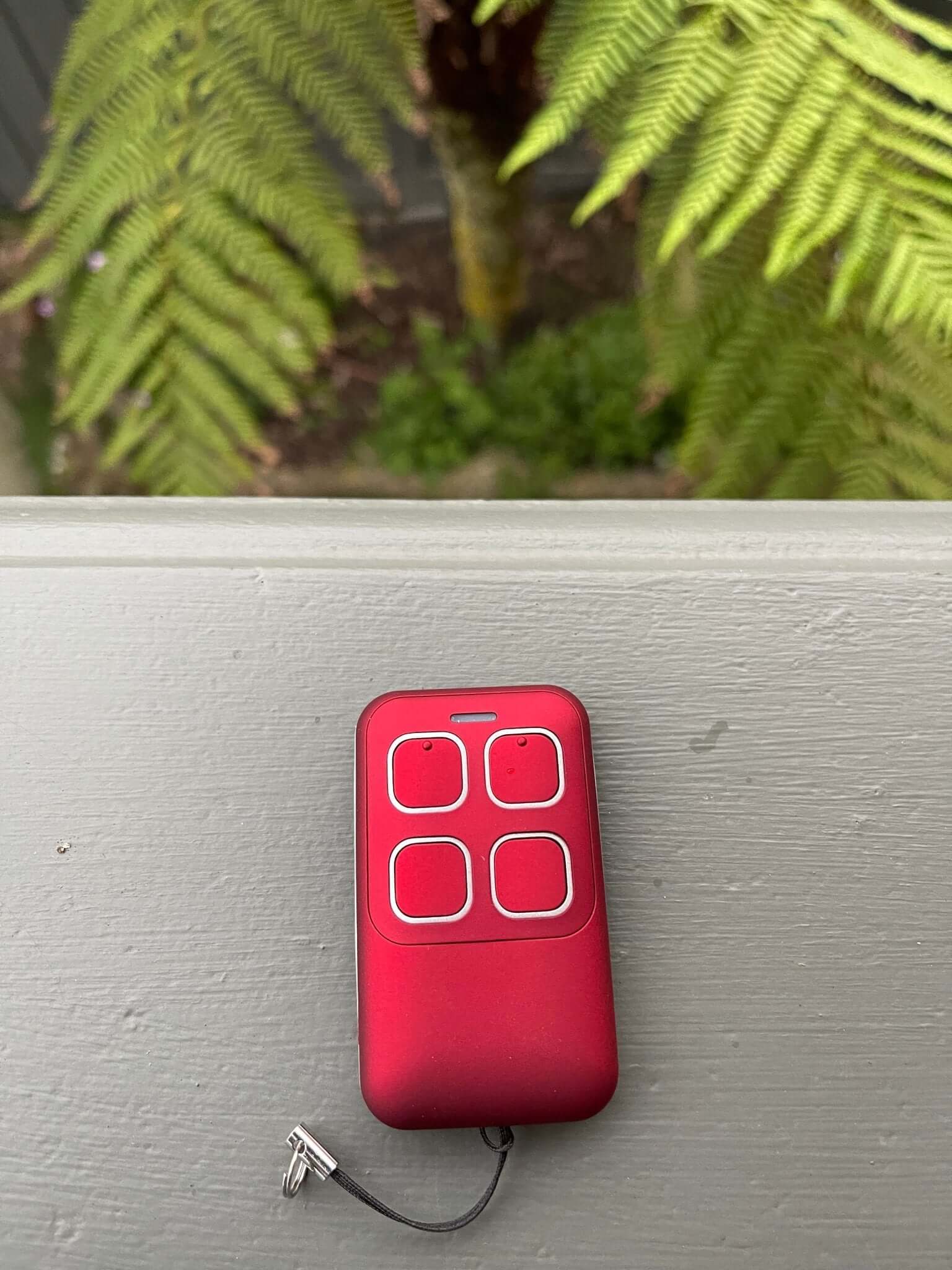 Red Gliderol compatible garage remote control with key ring, suitable for models like Rollamatic GDR II and GTS2000. Keywords: Garageway.