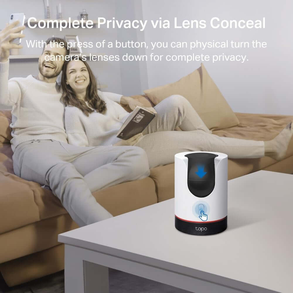 Tapo C225 Smart AI Indoor Camera with privacy mode enabled on a coffee table, featuring complete lens concealment.