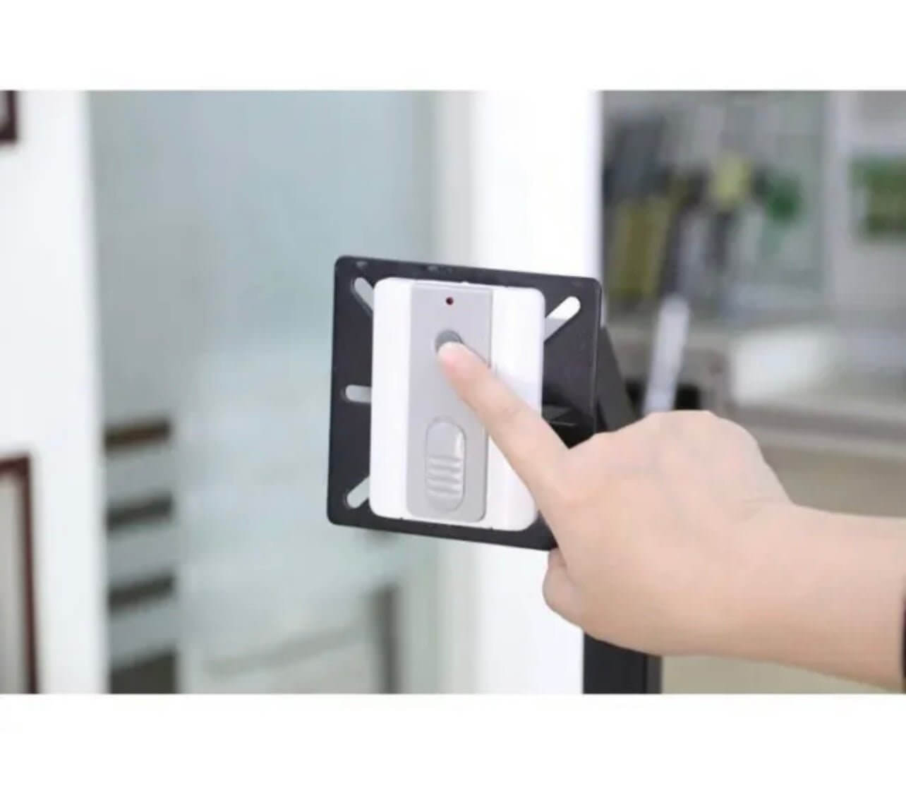 Person using Ritrox/Lockmaster LM173 wireless push button to open a garage or gate, enhancing convenience at home or in a vehicle. Garageway