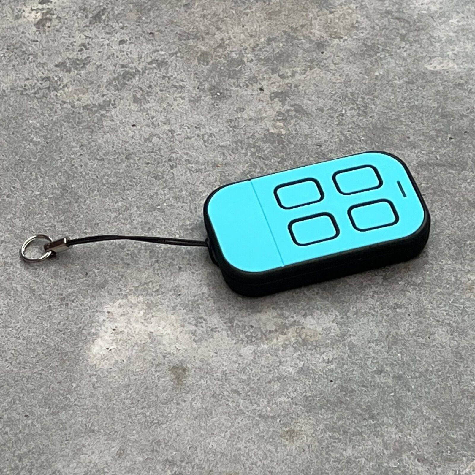 ATA PTX4 compatible remote control in blue with four buttons and keychain attachment.