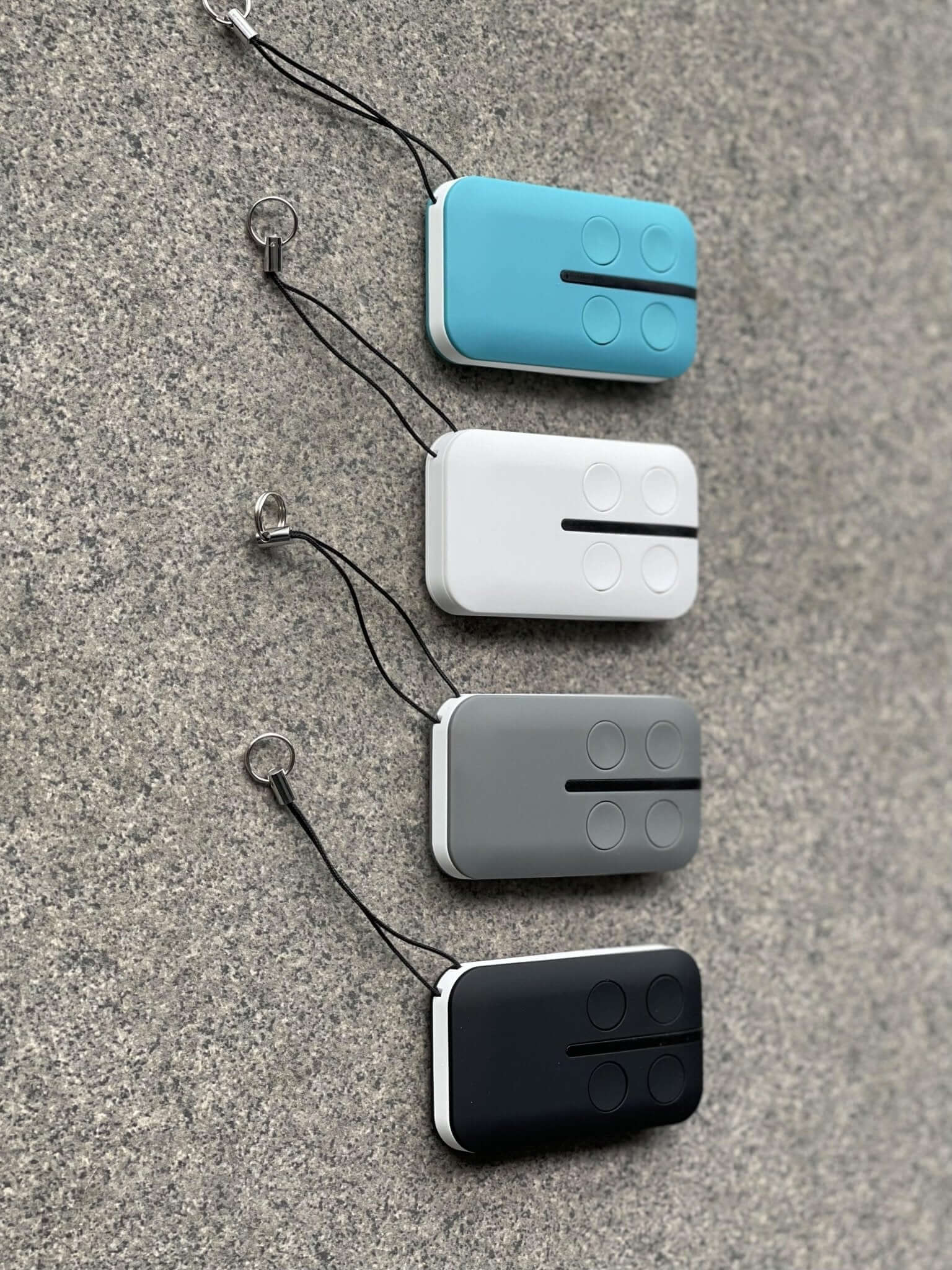 Four ATA PTX4 replacement remote controls in various colors with key rings, compatible with GDO models, excluding PTX5v1 and PX5V2.