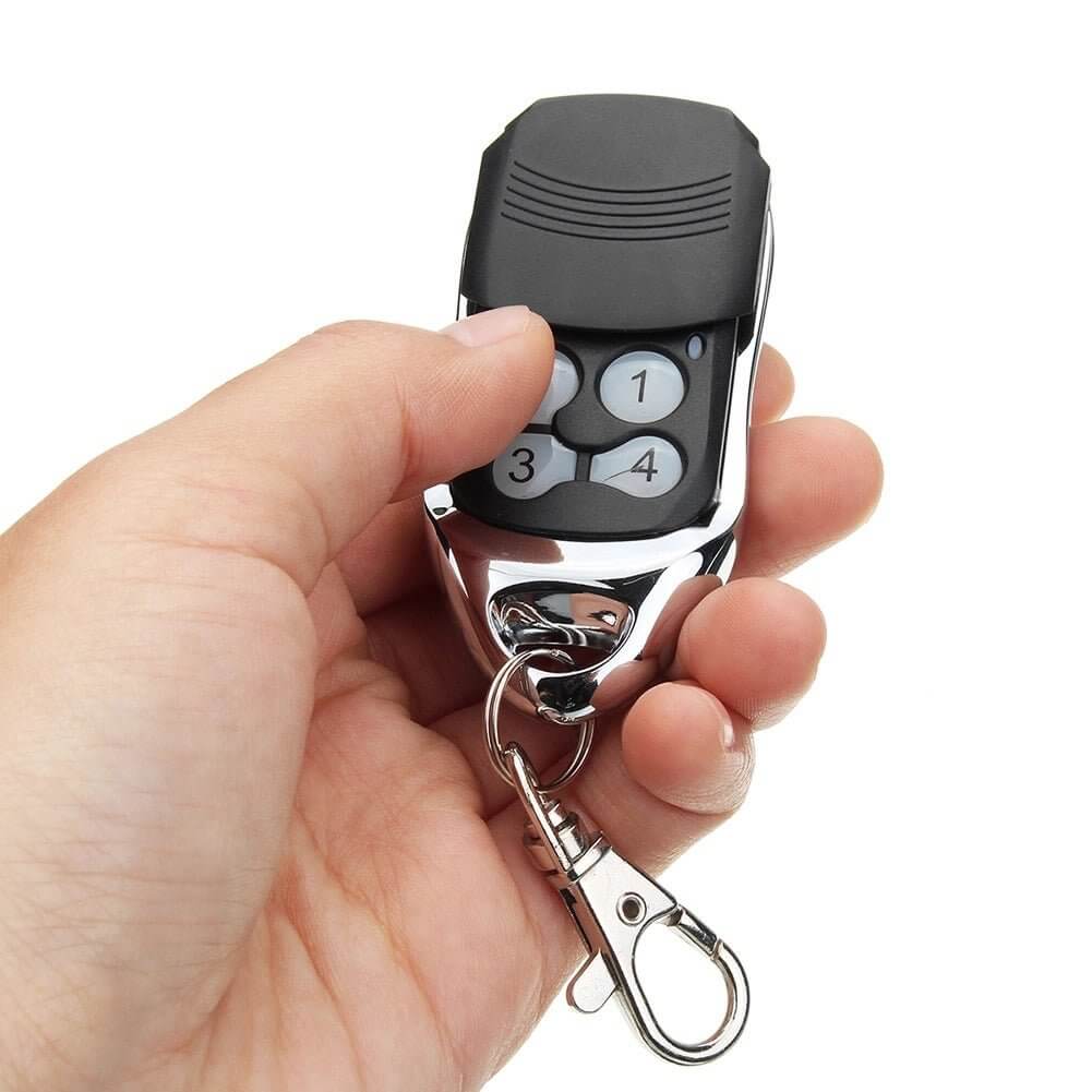 Centurion Avanti replacement remote control held in hand, compatible with various models, featuring key ring and black design by Garageway.