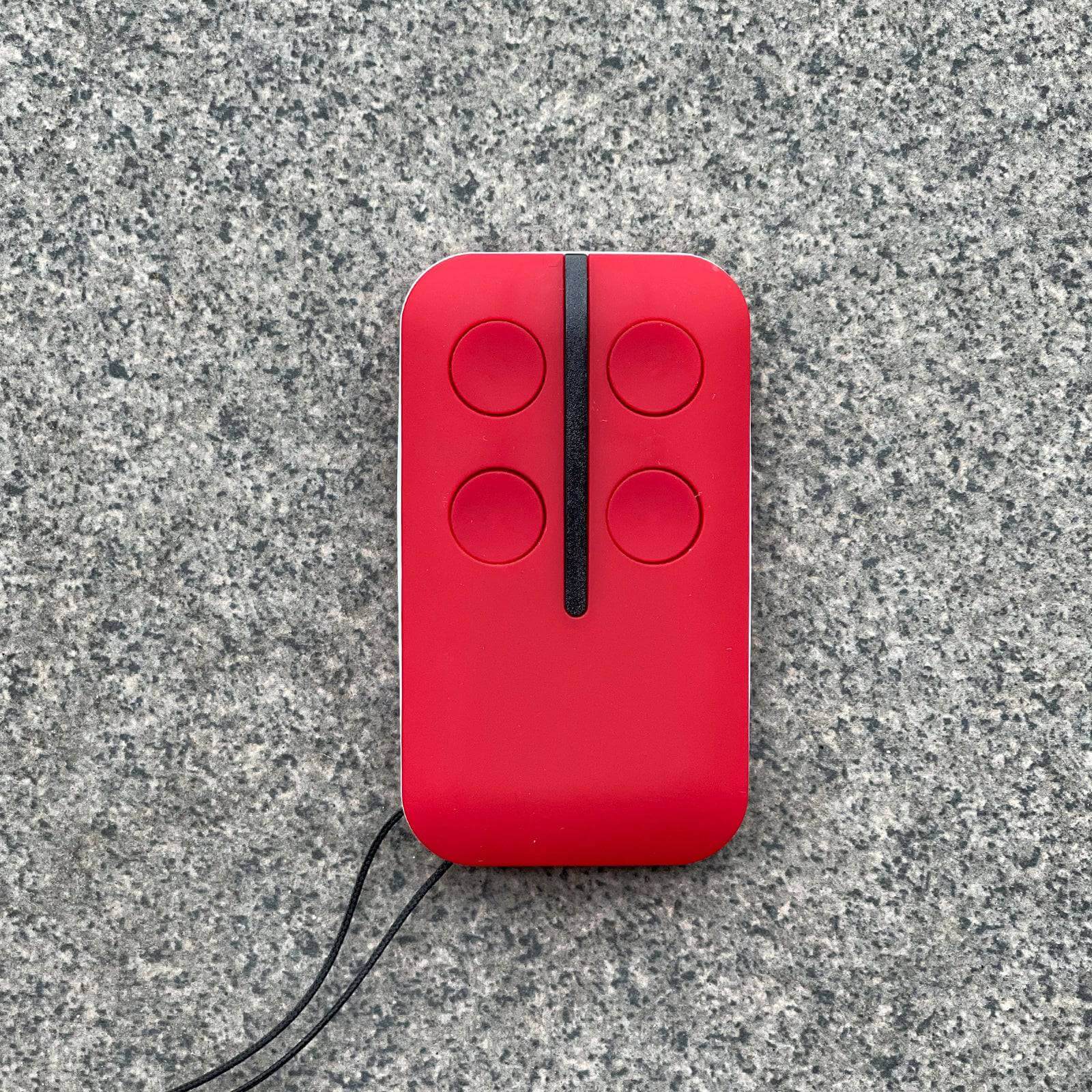 Red Ditec compatible remote control for garages and gates, featuring four buttons. Fits models GOL4, BIXLG4, BIXLP2, BIXLS2. Garageway.