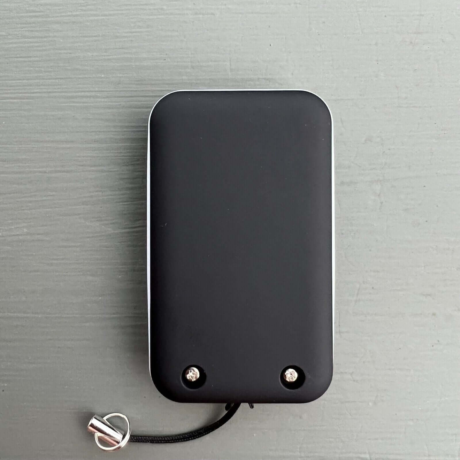 Black Gliderol compatible remote control with key ring and battery, suitable for Rollamatic GDR II, TM305C, GTS2000. Garageway.
