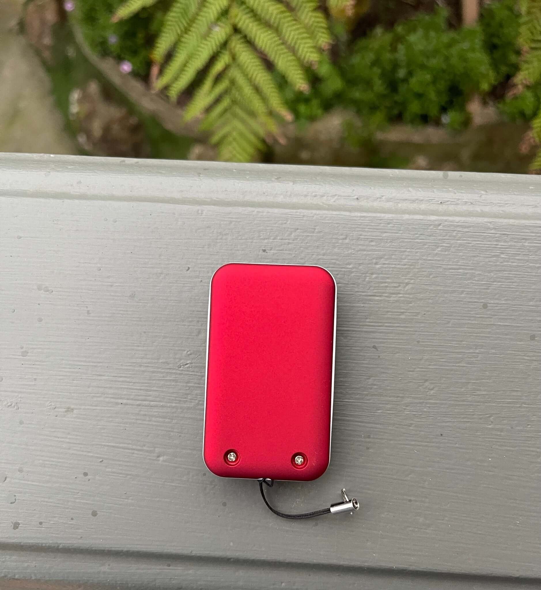 Red Gliderol Compatible Remote Control for garage, shown with key ring and battery, ideal for Rollamatic models. Garageway product.