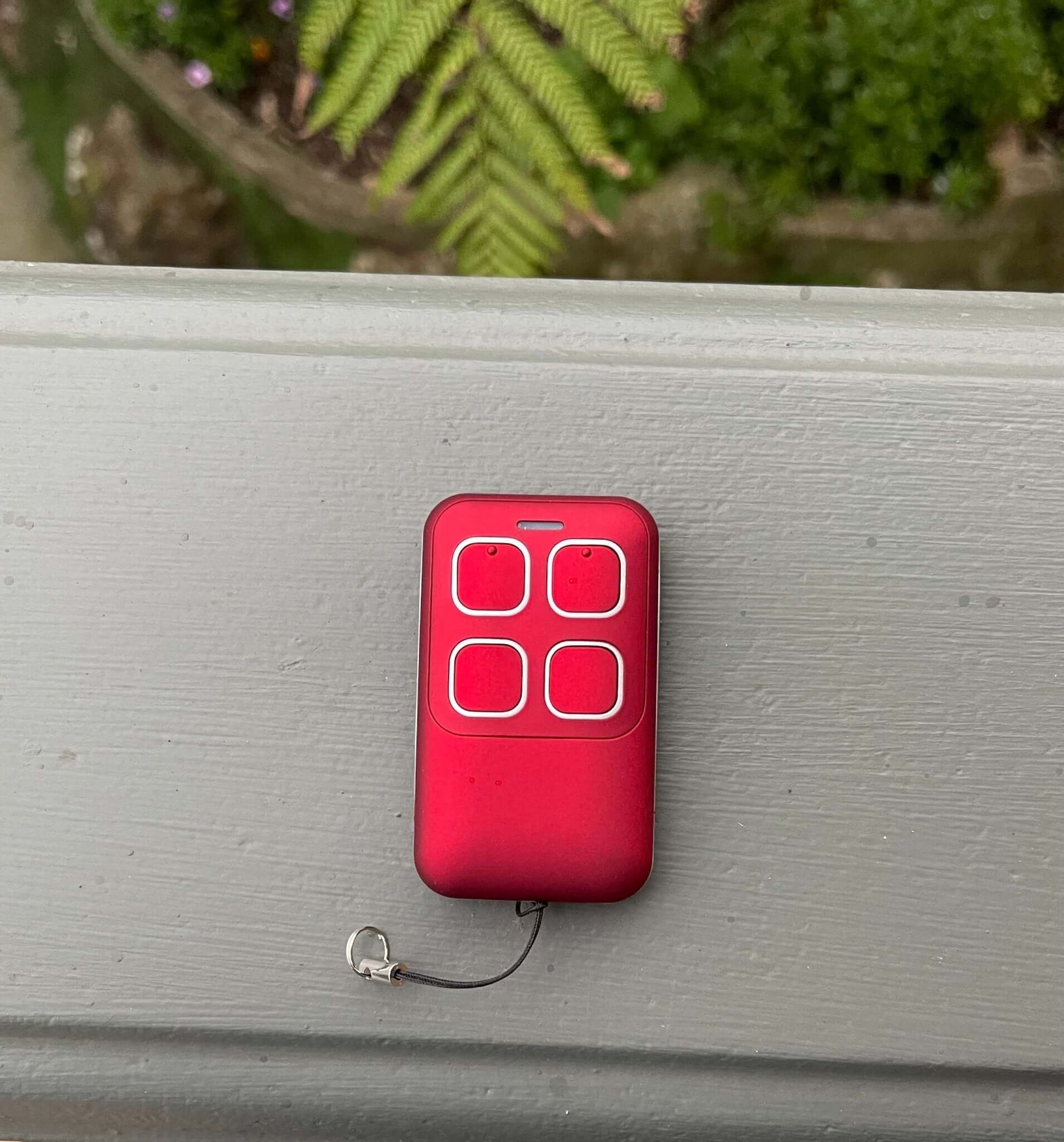 Red Gliderol compatible remote control for Rollamatic, GDR II, TM305C, GTS2000 models with key ring and battery. Brand: Garageway.