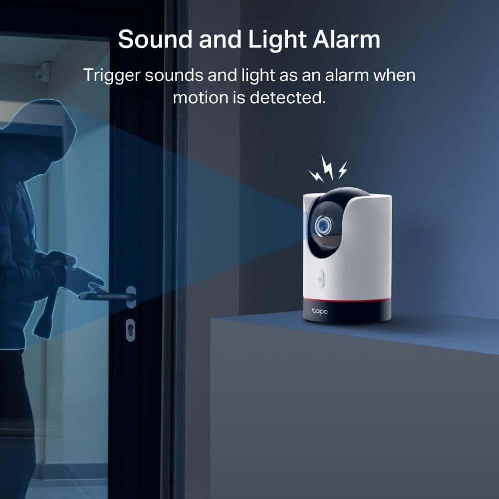 Tapo C225 Smart Indoor Camera with sound and light alarm feature, detecting intruder motion at night.